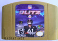 A Nintendo 64 physical game cartridge for the ROM Hack NFL BLitz 2025, featuring the special gold and silver plastic cartridge used for Pokémon Stadium 2.